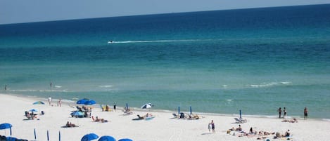 COMPLIMENTARY BEACH SERVICE-Mid March- Mid Oct. 1 Double Wood Lounge with Cushions & Umbrella