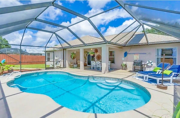 Charcoal grill, Lounge chairs, pool toys, inflatables, spacious seating area!