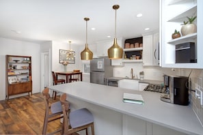 Kitchen, living room and dining nook in a large open floor plan.