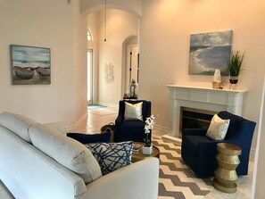 Modern furnishings with volume ceilings make this home a luxurious stay.