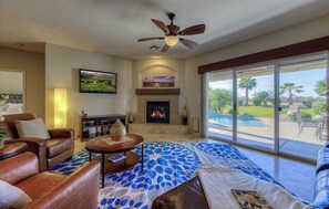 Large Living Room that opens up to private backyard and views of the Golf Course.