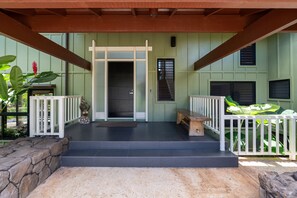 Front porch entrance with overhang to protect from rain and close to car