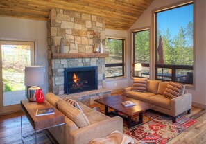 Cozy main floor seating area off deck with outdoor dining table