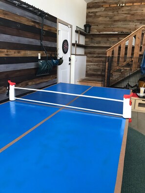 Ping pong table in heated garage game area