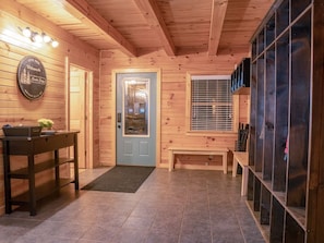 Main Level Entry, mud room with extra storage and on site laundry.