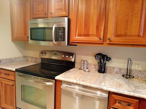 Stainless appliances in kitchen and granite counter tops