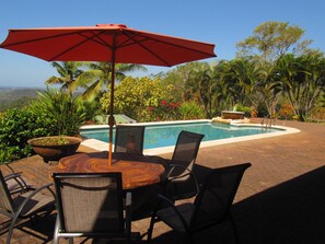 Pool seating area with shade umbrella