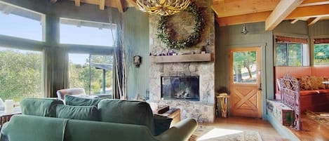 Living room with wood burning fireplace