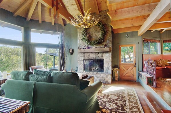 Living room with wood burning fireplace