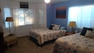 spacious 2nd bedroom with 2 queen beds and oversized reading chair