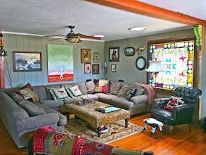 Living room with lots of seating TV is off to the right