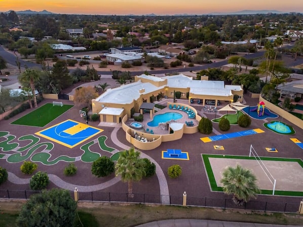 [Resort Property] Aerial View of the amenities including heated pool, basketball court, mini golf, sand volleyball, splash pad, and more!