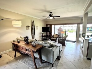 Relax in comfortable living room with TV viewable from kitchen and dining room