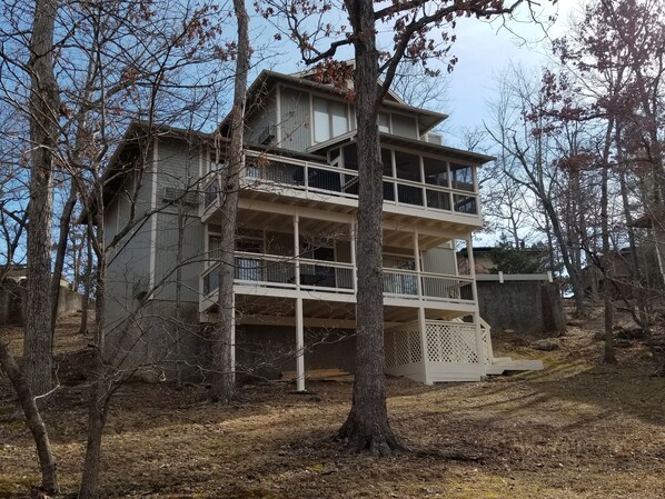 Rear of home facing woods and Cedar Glen pool.