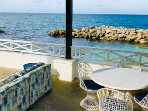 Lounge area overlooking sea cove