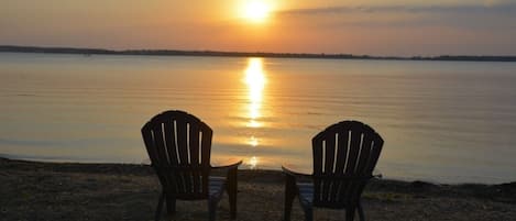 Level sandy beach with Sunsets