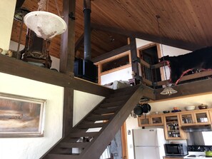 View from kitchen and dining area up to living room 