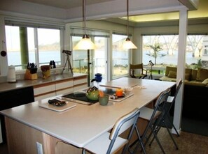 Living Room with Great Views and kitchen with basic supplies and cookware.