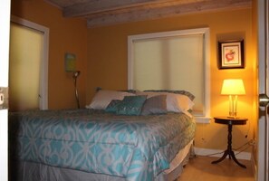 King size bed on main level with full bath. Kitchen and living room are on main.