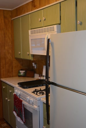 Kitchen - Fridge, Stove, Microwave, coffee pot, toaster