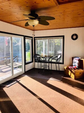 table and chairs to enjoy morning coffee in the three season room