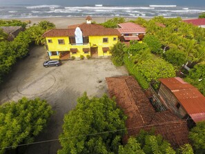 Back of the home parking, apartment and main house