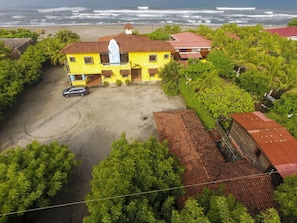 Back of the home parking, apartment and main house