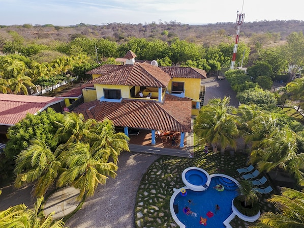 Aerial view of house and pool