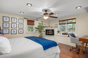 Primary bedroom with King sized bed, remote workspace and small electric fireplace - 10 Seventh Street Harwich Cape Cod - Cape Vista - NEVR