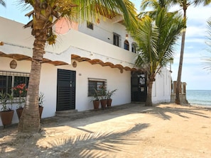 The front of La Esquina Perezosa with our new landscaping and beach access.