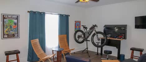 Living Room with Bike Repair, Stand, Storage for 9 Bikes, and Queen Sleeper Sofa