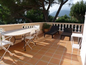 Terrace with electric roller shutters