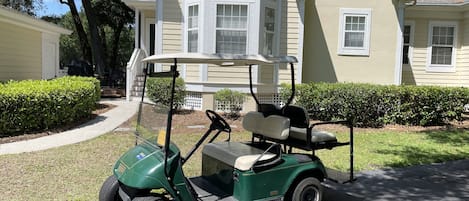 Front of house with Golf Cart