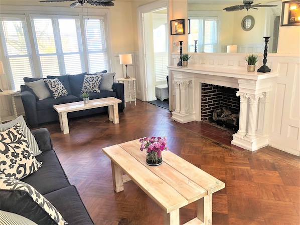 Large turn of century fireplace and connecting doors to sun room!