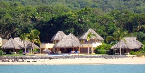 Las Palapas main building and 2 casitas.  200 feet of beach front.