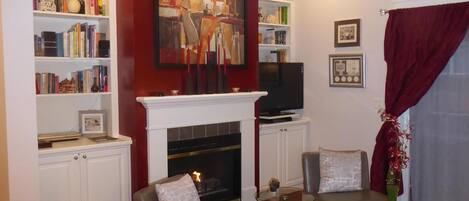 The gas fireplace for cozy evenings is the center of the living room