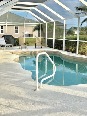 The pool has steps into the shallow end and a shelf in the deep end to sit down 