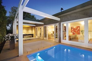 Outdoor area with heated plunge pool and a BBQ