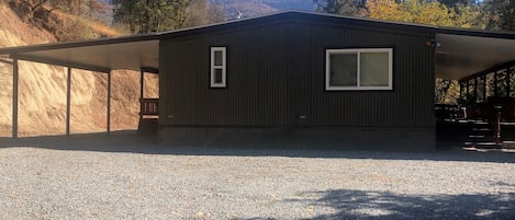 Entry to property, Carport, and Front deck with view of the Mountains and Pines 