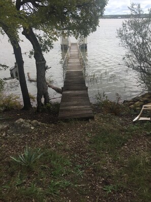 The dock! Located just below the fifth wheel on the east side of property. 