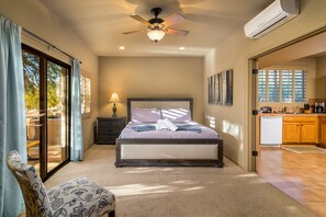 Experience comfort and elegance in a bedroom overlooking the kitchen through exquisite windowed French doors. #SeamlessElegance 🏡🛏️🪟