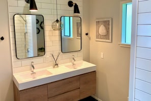 RECENTLY REMODELED bathroom. Dual vanity, deep water tub, hansgrohe fixtures.