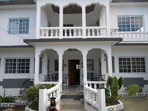 Colonial style building with lots of balcony space.