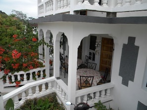 Looking onto the main floor, front balcony. Gathering and dining area for 10