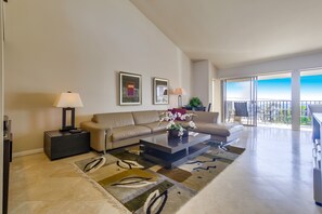 Open and bright living room with cathedral ceiling