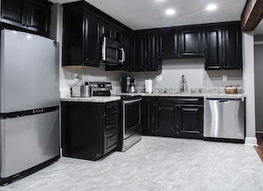 Kitchen stocked with basic cooking necessities.