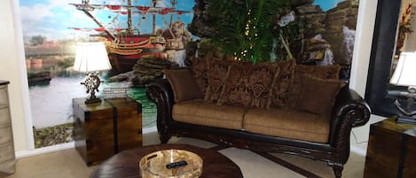 Living room with pirate ship mural and treasure chests
