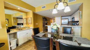 Minibar, dining area, and kitchen