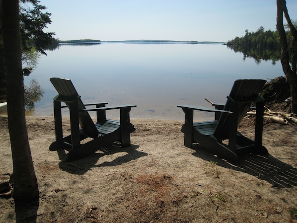 Your own private natural sand beach, with hammock, picnic table, and kayaks.