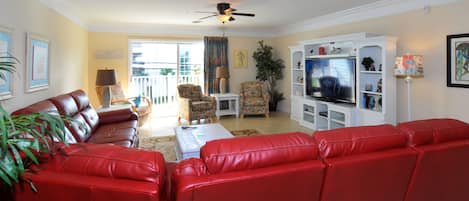 Living Room with 60 inch HDTV, lots of seating room.